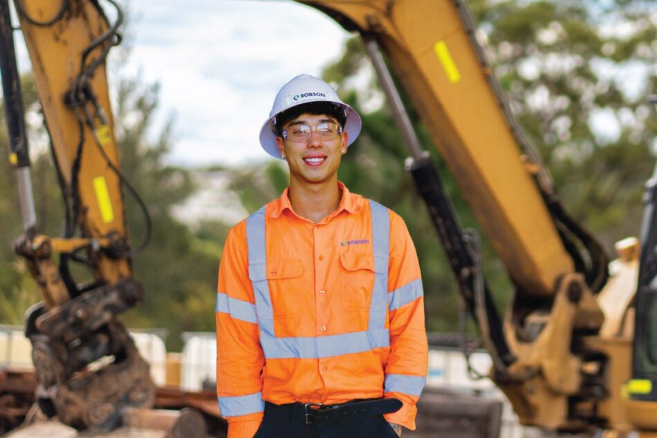 Graduate Civil Engineer looking at camera on job site